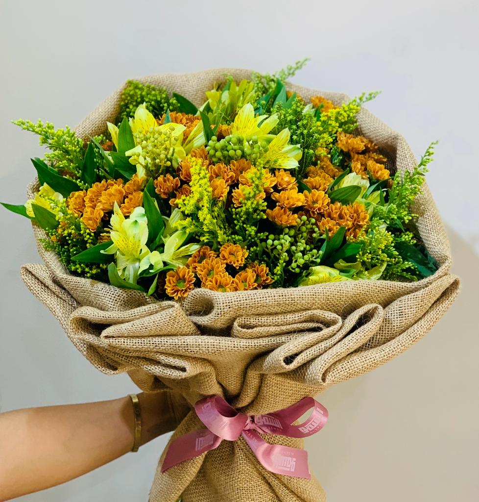 Hand held bouquet of flowers