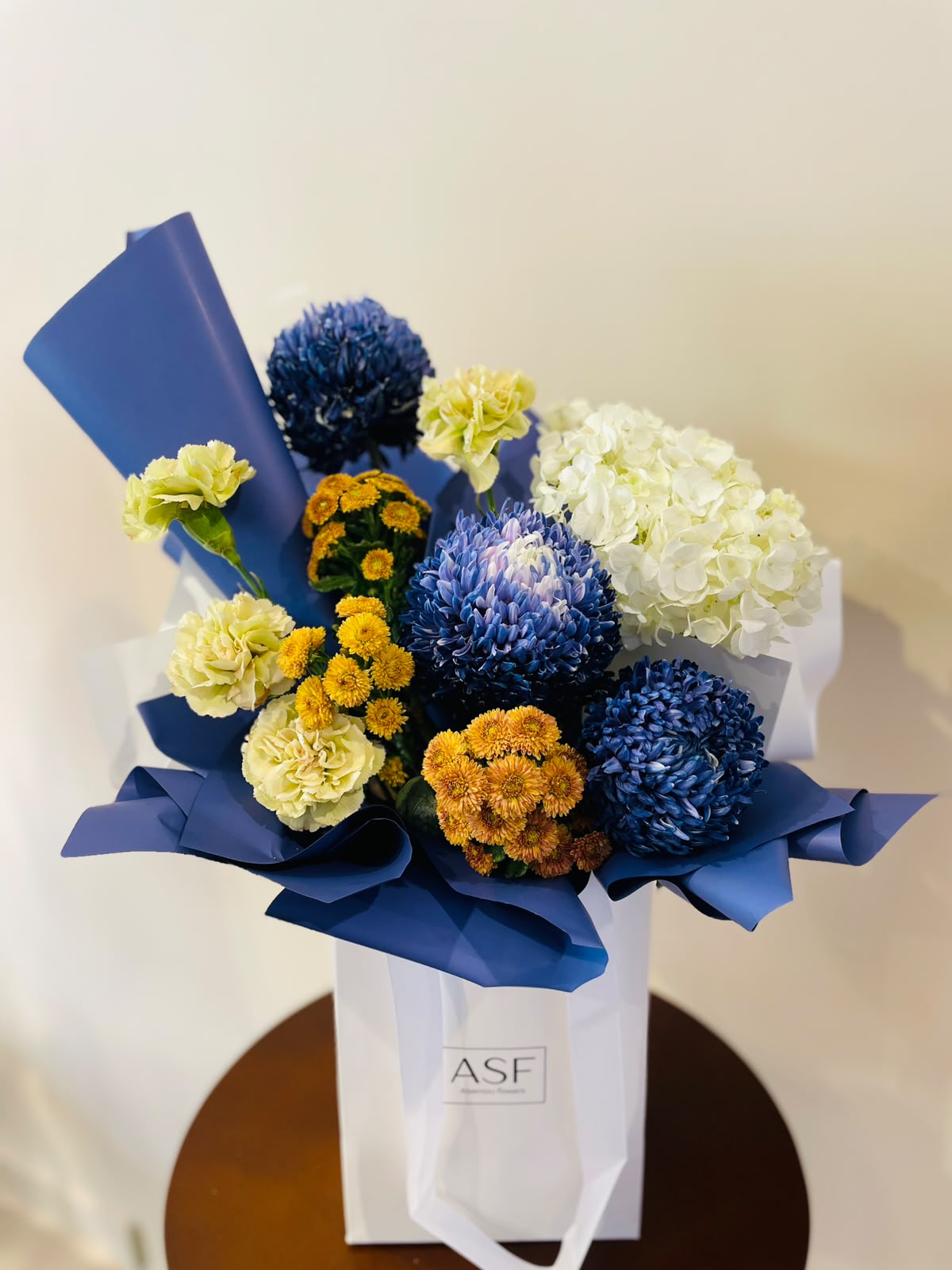 blue flowers with beige in a bouquet